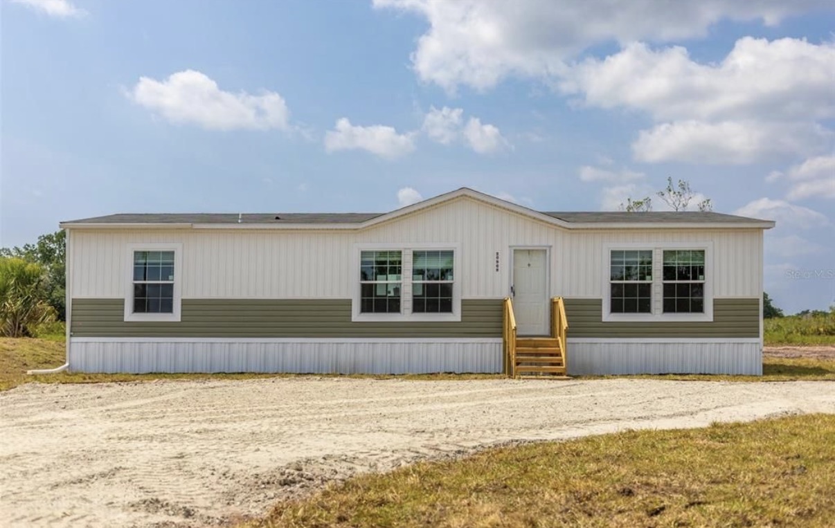 Wide manufactured home on sandy lot — Polk County, FL